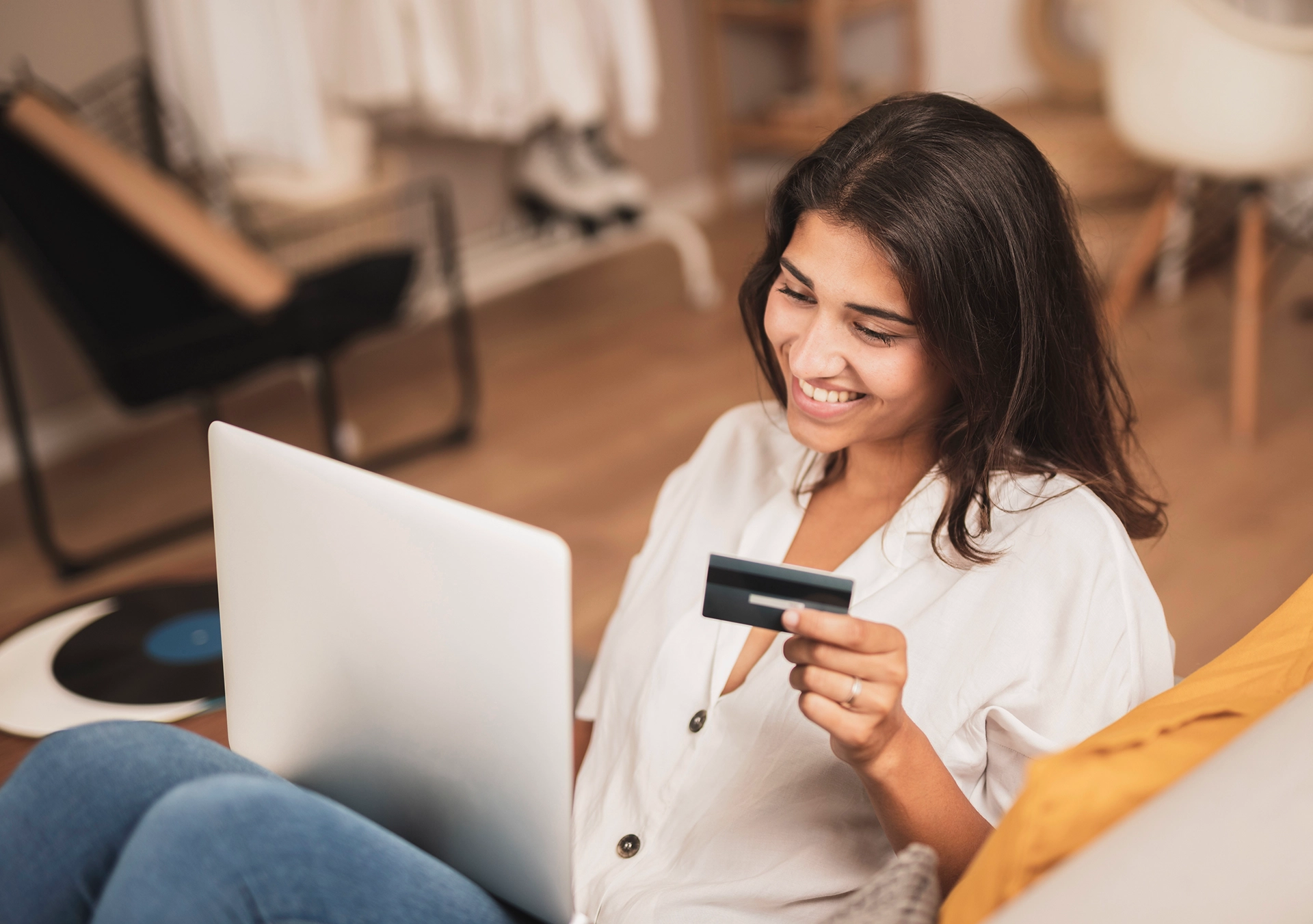 Woman with laptop and card